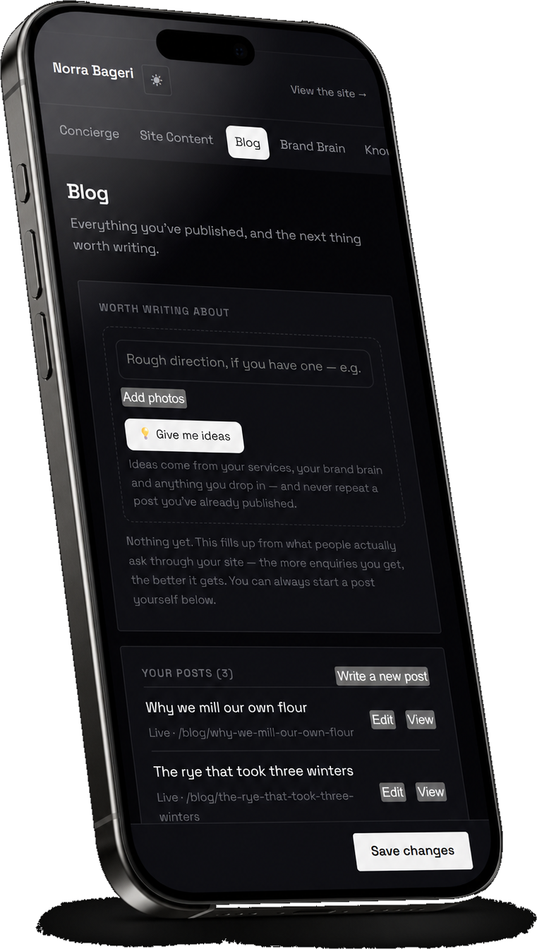 The OkenDesk blog panel on a phone in dark mode, showing the idea generator and the post list